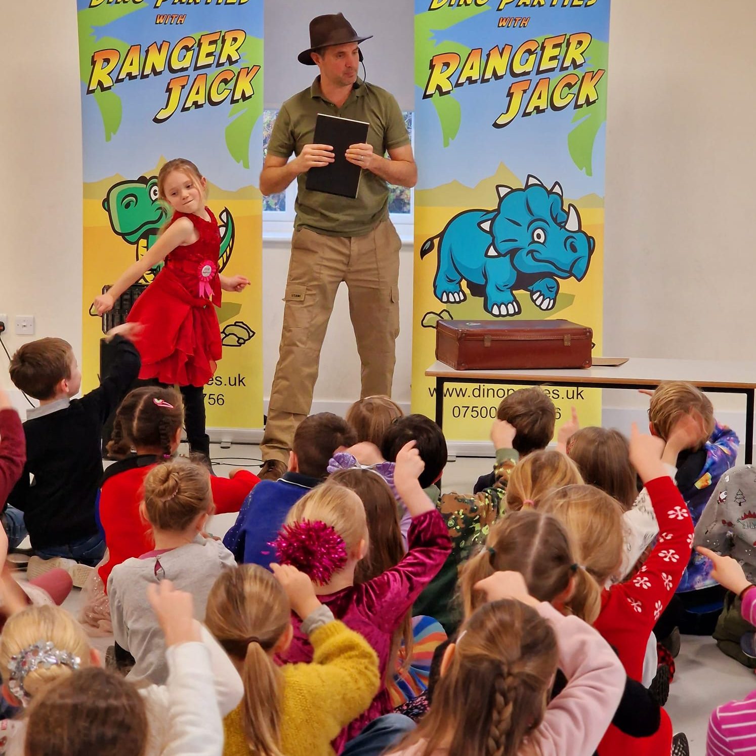 Happy children participating whilst taking part in a Dino Party with Ranger Jack